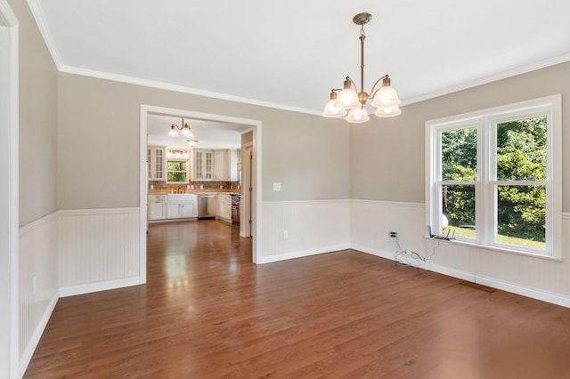 3035 Culleoka Hwy, Culleoka, TN 38451 - empty room with a chandelier, wainscoting, dark wood-style floors, and crown molding