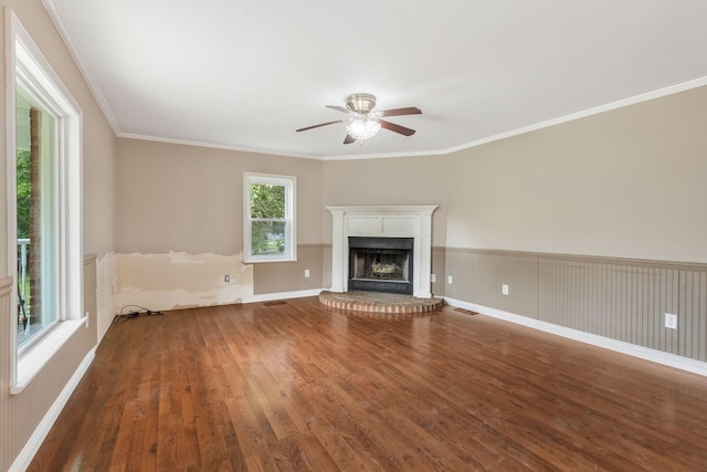 3035 Culleoka Hwy, Culleoka, TN 38451 - unfurnished living room with ceiling fan, wood finished floors, a fireplace, ornamental molding, and a wainscoted wall