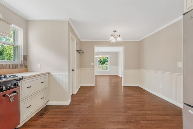 3035 Culleoka Hwy, Culleoka, TN 38451 - kitchen with a chandelier, dark wood-type flooring, wainscoting, decorative backsplash, and light countertops