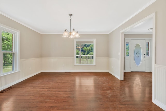3035 Culleoka Hwy, Culleoka, TN 38451 - spare room featuring plenty of natural light, a chandelier, a wainscoted wall, wood finished floors, and crown molding