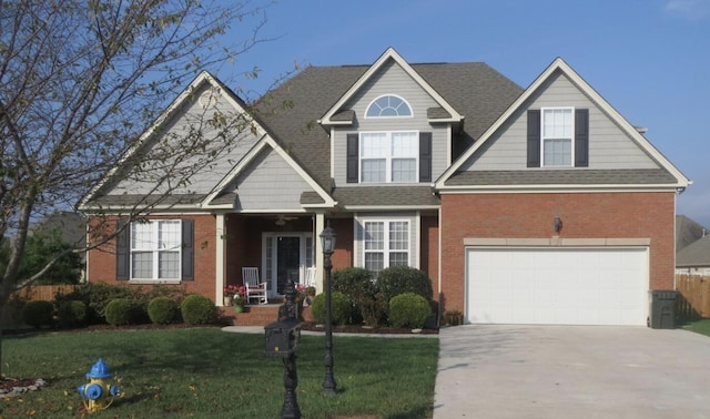 6765 Buckhannon Ln, Hixson, TN 37343 - view of front facade with concrete driveway, brick siding, a front yard, and an attached garage