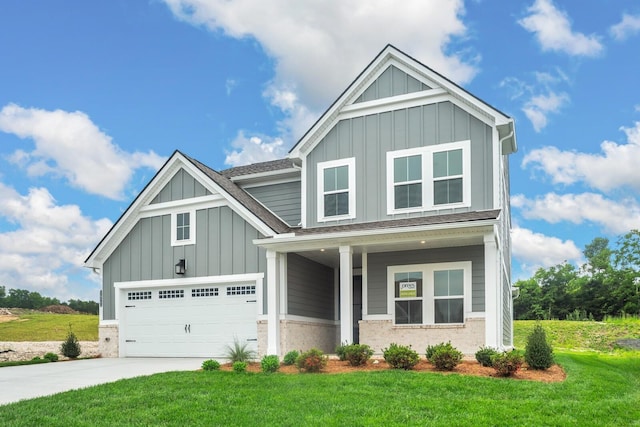 1922 Hildebrand Ln, Columbia, TN 38401 - craftsman-style house featuring board and batten siding, a front yard, a garage, driveway, and roof with shingles