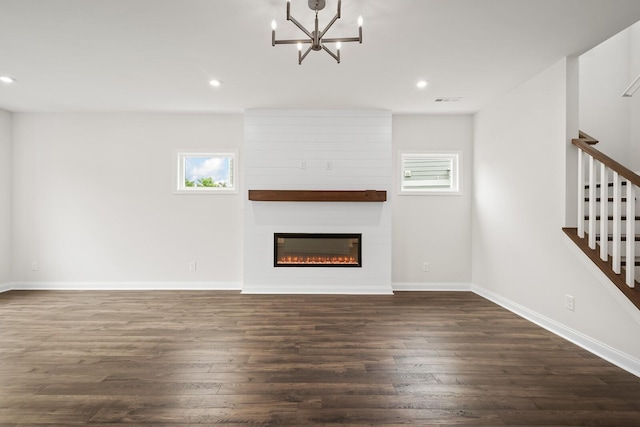 1922 Hildebrand Ln, Columbia, TN 38401 - unfurnished living room with dark wood-style floors, plenty of natural light, recessed lighting, a large fireplace, and a chandelier