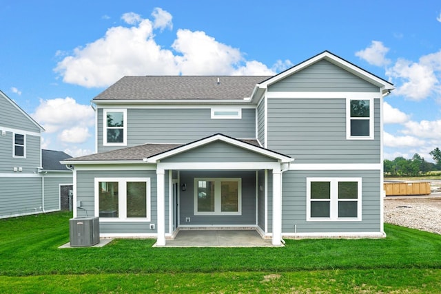 1922 Hildebrand Ln, Columbia, TN 38401 - back of house featuring a patio area, a lawn, and a shingled roof