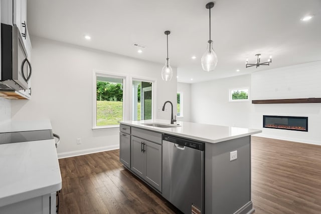 1922 Hildebrand Ln, Columbia, TN 38401 - kitchen with stainless steel appliances, gray cabinets, dark wood-type flooring, light countertops, and plenty of natural light