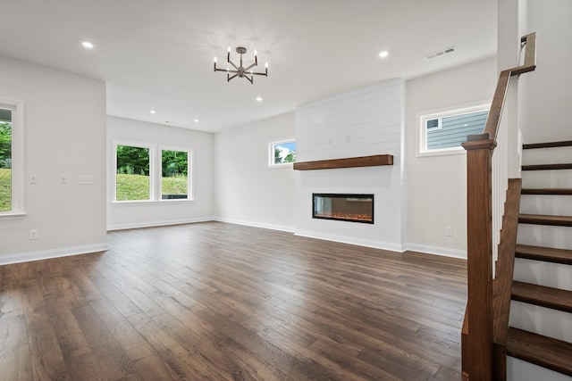1922 Hildebrand Ln, Columbia, TN 38401 - unfurnished living room featuring dark wood finished floors, stairs, a chandelier, recessed lighting, and a fireplace