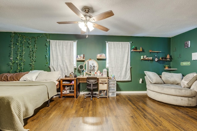 528 Maple St, Pulaski, TN 38478 - bedroom featuring wood finished floors, a textured ceiling, a desk, and a ceiling fan