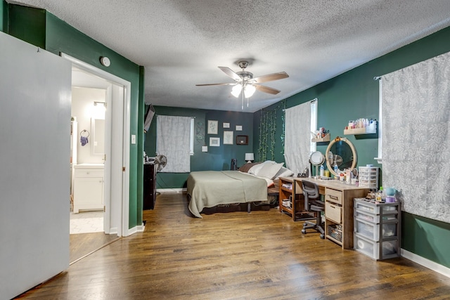 528 Maple St, Pulaski, TN 38478 - bedroom featuring wood finished floors, a textured ceiling, ceiling fan, and ensuite bath