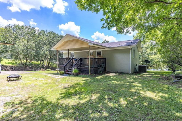 528 Maple St, Pulaski, TN 38478 - back of house featuring brick siding, a fire pit, and a lawn