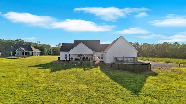 426 Maple Bend Rd, Winchester, TN 37398 - rear view of house featuring a swimming pool and a yard