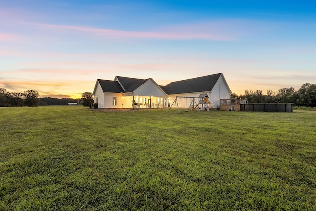 426 Maple Bend Rd, Winchester, TN 37398 - back of property at dusk featuring a lawn
