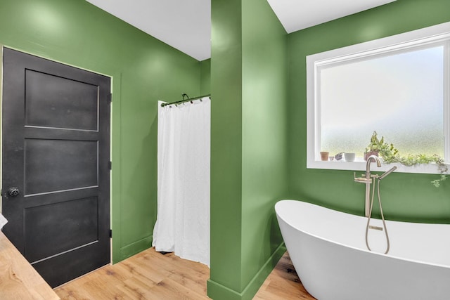 426 Maple Bend Rd, Winchester, TN 37398 - full bath with wood finished floors and a freestanding bath