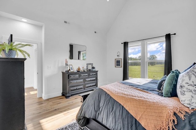 426 Maple Bend Rd, Winchester, TN 37398 - bedroom with high vaulted ceiling, light wood-type flooring, and recessed lighting