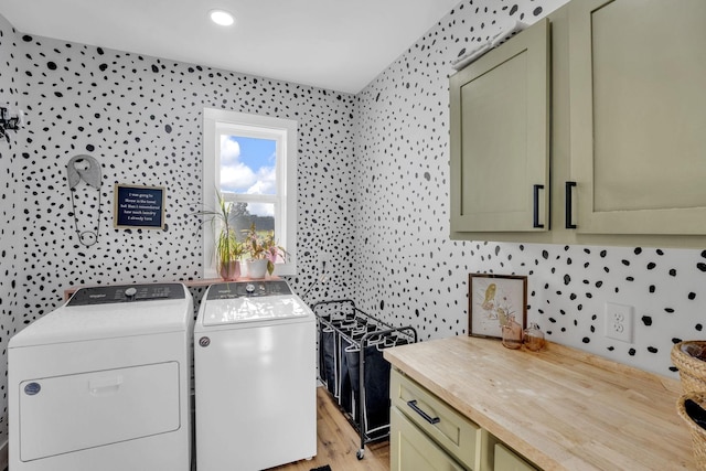 426 Maple Bend Rd, Winchester, TN 37398 - washroom with cabinet space, separate washer and dryer, wallpapered walls, and light wood finished floors