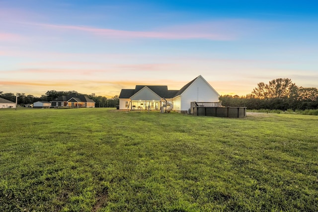 426 Maple Bend Rd, Winchester, TN 37398 - yard at dusk featuring a lawn