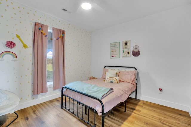426 Maple Bend Rd, Winchester, TN 37398 - bedroom with wallpapered walls, wood finished floors, and ceiling fan