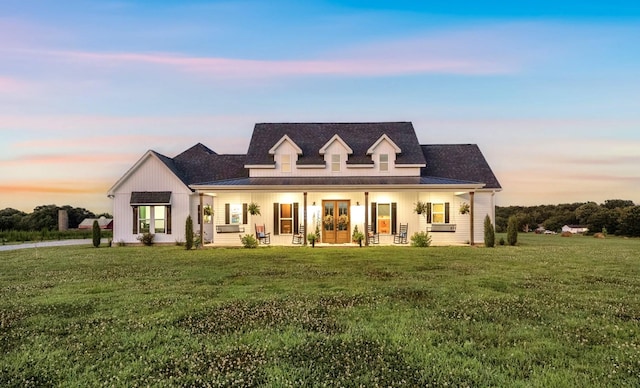 426 Maple Bend Rd, Winchester, TN 37398 - modern farmhouse style home featuring french doors, a front lawn, a metal roof, and a standing seam roof