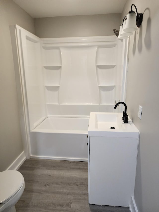 810 Lynwood St, Winchester, TN 37398 - full bath with wood finished floors, shower / bath combination, and vanity