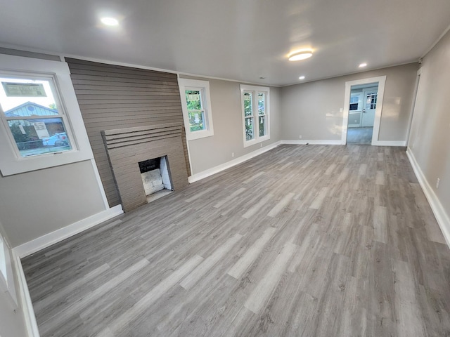 810 Lynwood St, Winchester, TN 37398 - unfurnished living room with wood finished floors, a fireplace, and recessed lighting