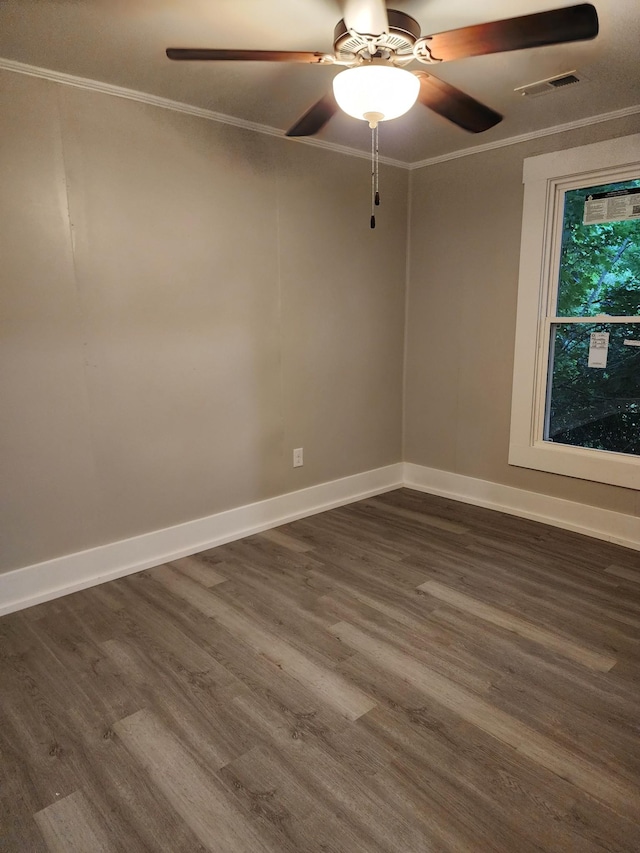 810 Lynwood St, Winchester, TN 37398 - spare room featuring dark wood-style flooring, ceiling fan, and crown molding