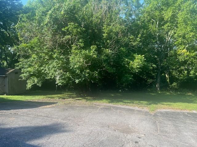 320 Shepherd Hills Dr, Madison, TN 37115 - view of grassy yard with a storage unit
