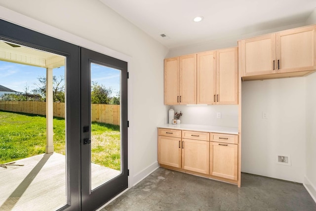 1823 River Dr, Nashville, TN 37218 - kitchen with light brown cabinetry, french doors, recessed lighting, light countertops, and concrete flooring