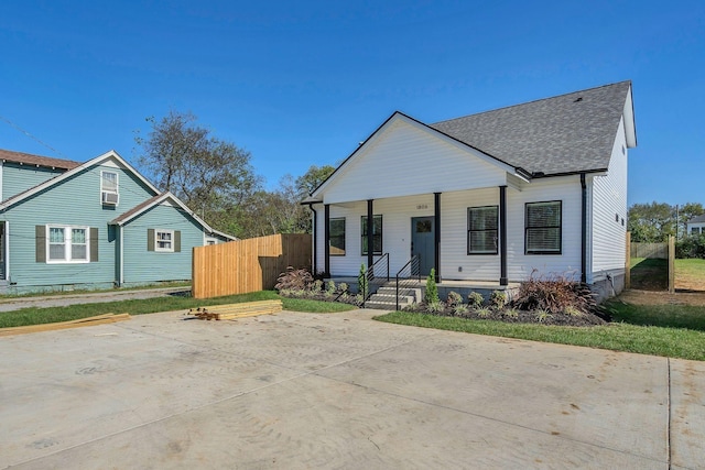 1823 River Dr, Nashville, TN 37218 - view of front of house with a shingled roof and a porch