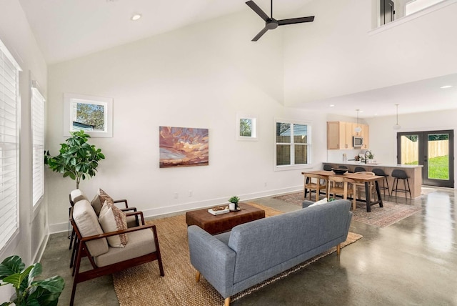 1823 River Dr, Nashville, TN 37218 - living area with ceiling fan, high vaulted ceiling, finished concrete floors, and recessed lighting
