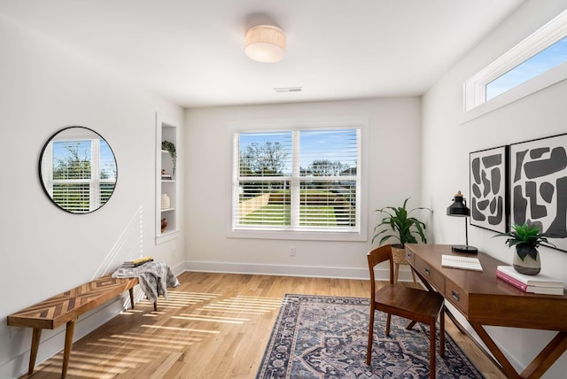 1823 River Dr, Nashville, TN 37218 - home office with light wood-type flooring and built in shelves