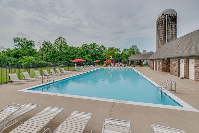 2008 Kingston Pl, Spring Hill, TN 37174 - community pool with a patio and view of scattered trees
