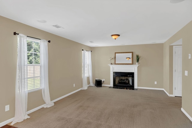 2008 Kingston Pl, Spring Hill, TN 37174 - unfurnished living room featuring a fireplace with flush hearth and carpet
