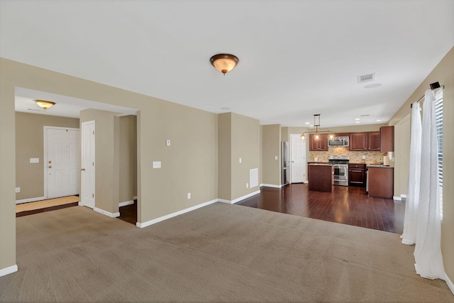 2008 Kingston Pl, Spring Hill, TN 37174 - unfurnished living room featuring dark carpet and baseboards