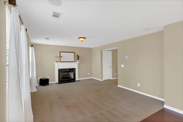 2008 Kingston Pl, Spring Hill, TN 37174 - unfurnished living room with a fireplace with flush hearth and carpet