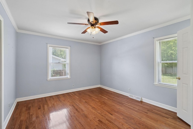 2311 Mayfair Ave, Murfreesboro, TN 37130 - unfurnished room featuring healthy amount of natural light, wood finished floors, a ceiling fan, and crown molding
