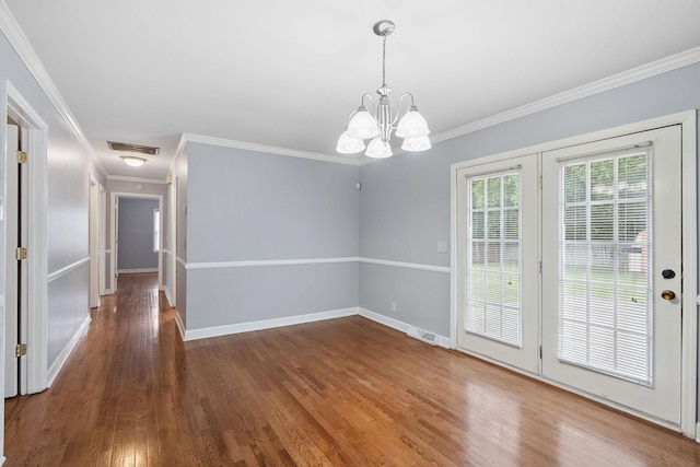 2311 Mayfair Ave, Murfreesboro, TN 37130 - unfurnished dining area with ornamental molding, wood finished floors, and a chandelier