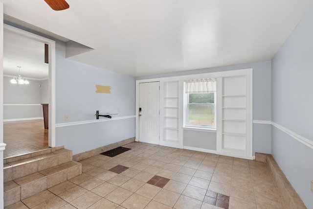 2311 Mayfair Ave, Murfreesboro, TN 37130 - foyer with light tile patterned floors and a chandelier
