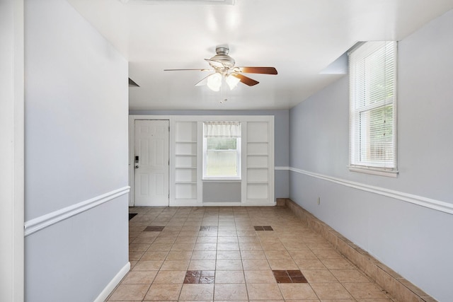 2311 Mayfair Ave, Murfreesboro, TN 37130 - unfurnished room with built in features, healthy amount of natural light, a ceiling fan, and light tile patterned floors