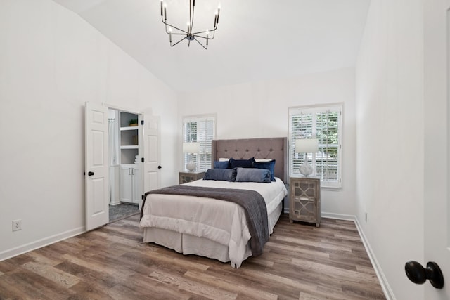201 Hideaway Trl, Franklin, TN 37069 - bedroom with a chandelier, wood finished floors, and high vaulted ceiling