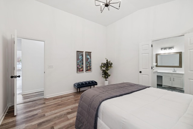 201 Hideaway Trl, Franklin, TN 37069 - bedroom with wood finished floors, a chandelier, high vaulted ceiling, and connected bathroom