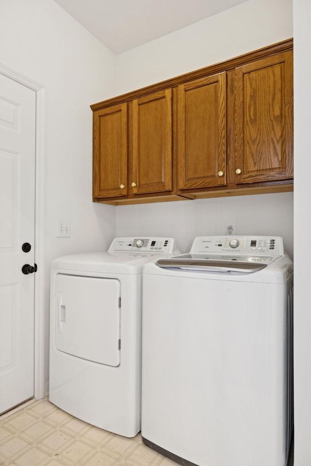 201 Hideaway Trl, Franklin, TN 37069 - washroom with independent washer and dryer, cabinet space, and light floors