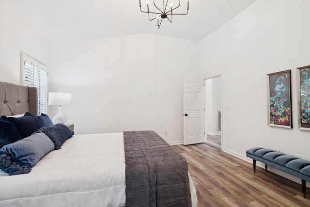 201 Hideaway Trl, Franklin, TN 37069 - bedroom featuring a chandelier, wood finished floors, and high vaulted ceiling