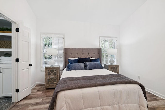 201 Hideaway Trl, Franklin, TN 37069 - bedroom with multiple windows, wood finished floors, and vaulted ceiling