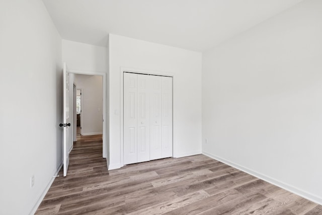 201 Hideaway Trl, Franklin, TN 37069 - unfurnished bedroom featuring wood finished floors and a closet