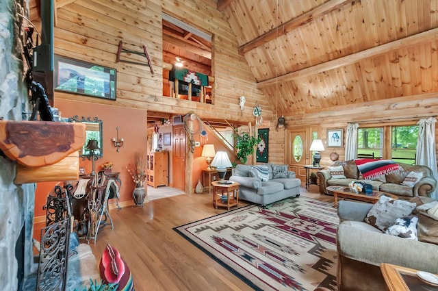 20151 Ben Fly Rd, Lyles, TN 37098 - living area with high vaulted ceiling, wood finished floors, a wood ceiling with exposed beams, and log walls