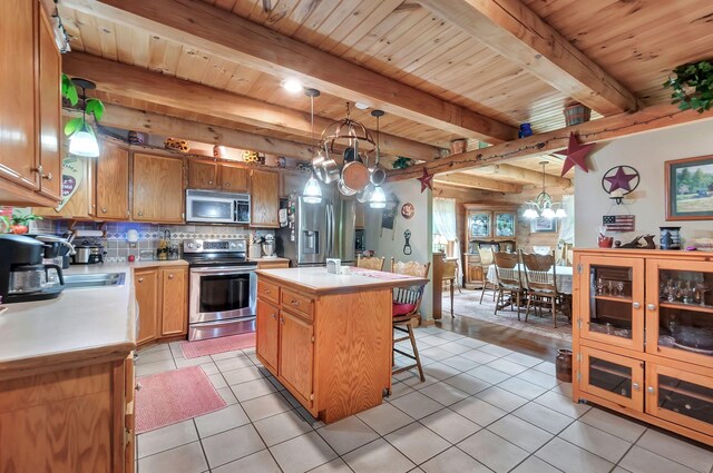 20151 Ben Fly Rd, Lyles, TN 37098 - kitchen featuring stainless steel appliances, a chandelier, light countertops, a wood ceiling with exposed beams, and decorative backsplash