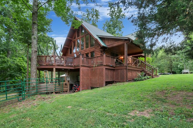 20151 Ben Fly Rd, Lyles, TN 37098 - rear view of house with a lawn, log exterior, a metal roof, and a deck