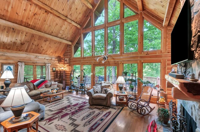 20151 Ben Fly Rd, Lyles, TN 37098 - living room with high vaulted ceiling, wood finished floors, healthy amount of natural light, and a wooden ceiling with exposed beams