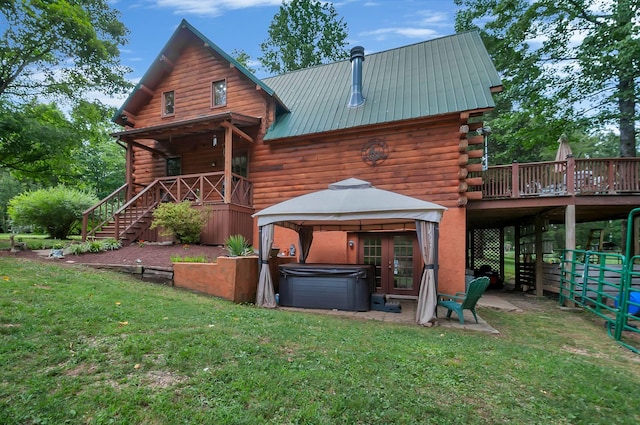 20151 Ben Fly Rd, Lyles, TN 37098 - back of property with a hot tub, log siding, stairway, a lawn, and a gazebo