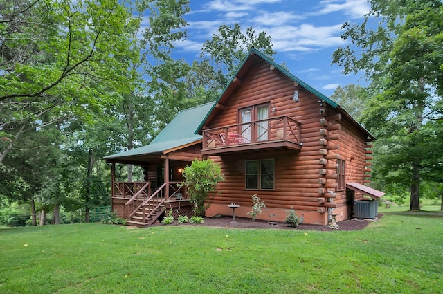 20151 Ben Fly Rd, Lyles, TN 37098 - view of front facade featuring a front yard, log siding, and covered porch