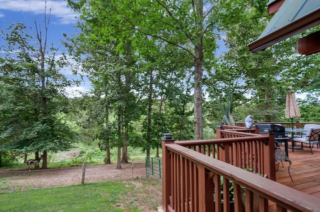 20151 Ben Fly Rd, Lyles, TN 37098 - view of yard with a wooden deck, outdoor dining space, and view of wooded area